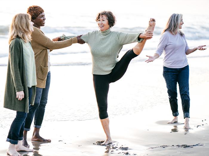 yoga old woman in the beach